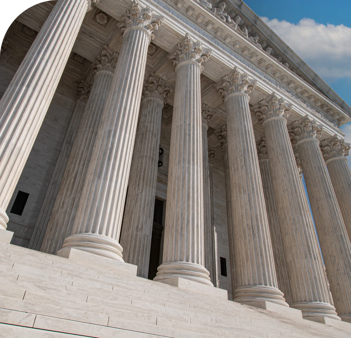 Marble columns of a grand courthouse building.