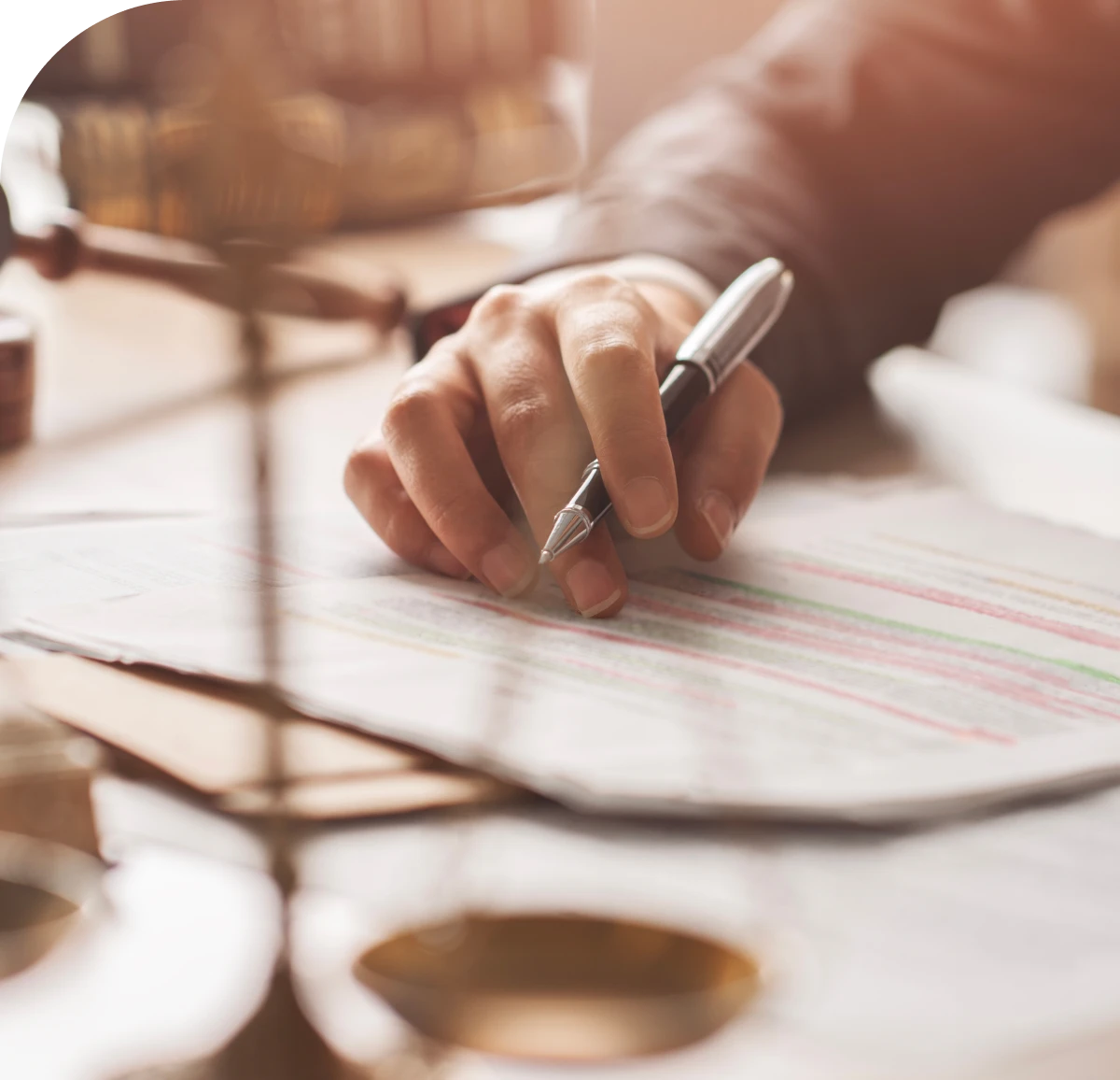 Hand writing on paper with a pen.