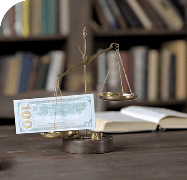 Scales balancing money and justice in library.