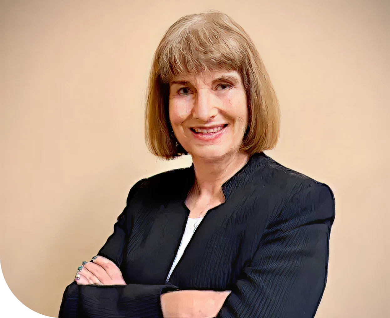Smiling woman in a black blazer.